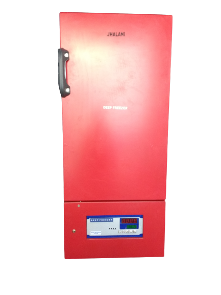 person writing in a notebook beside by an iPad, laptop, printed photos, spectacles, and a cup of coffee on a saucer