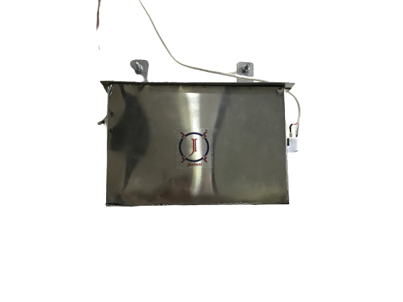 person writing in a notebook beside by an iPad, laptop, printed photos, spectacles, and a cup of coffee on a saucer