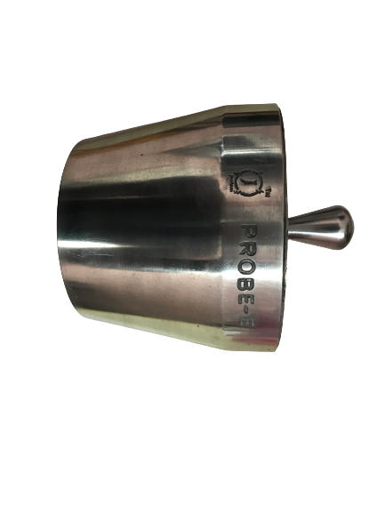 back view of woman wearing a backpack and beanie waiting to cross the road on a busy street at night in New York City, USA