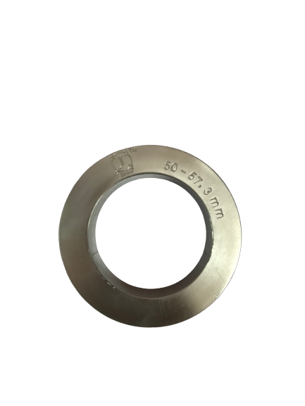 man wearing a black jacket, white shirt, blue jeans, and brown boots, playing a white electric guitar while sitting on an amp